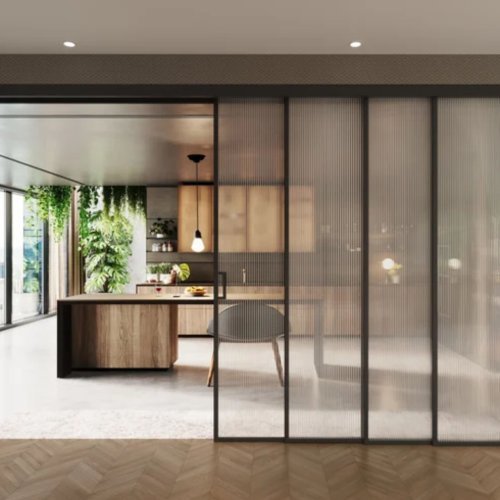 Modern sliding glass doors opening to a serene outdoor garden, offering a sleek and contemporary design for luxury homes in Dubai by Elegant Rooms